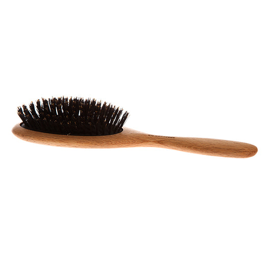 Stor hårborste med svinborst. Denna hårborste har egenskaper som hjälper till att bibehålla hårets naturliga mjukhet och lyster.